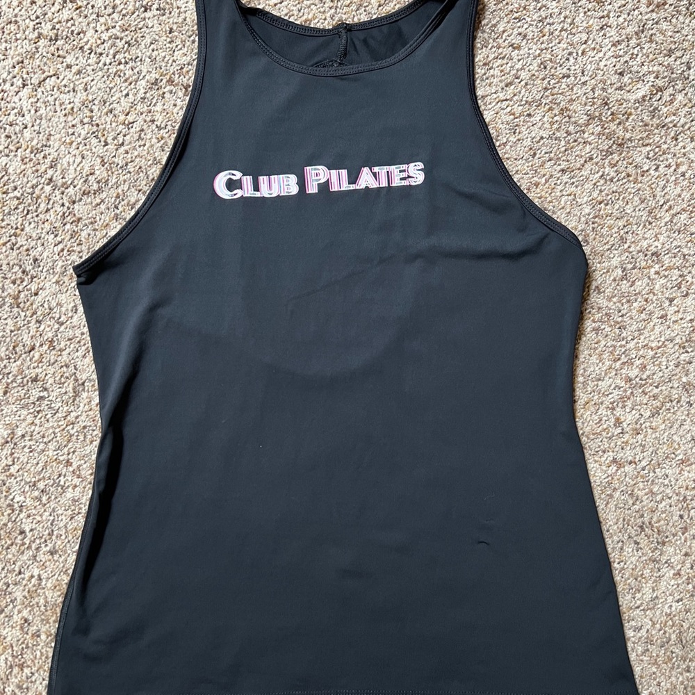 Key hole back tank. Slight misprint of lettering on front. Club Pilates